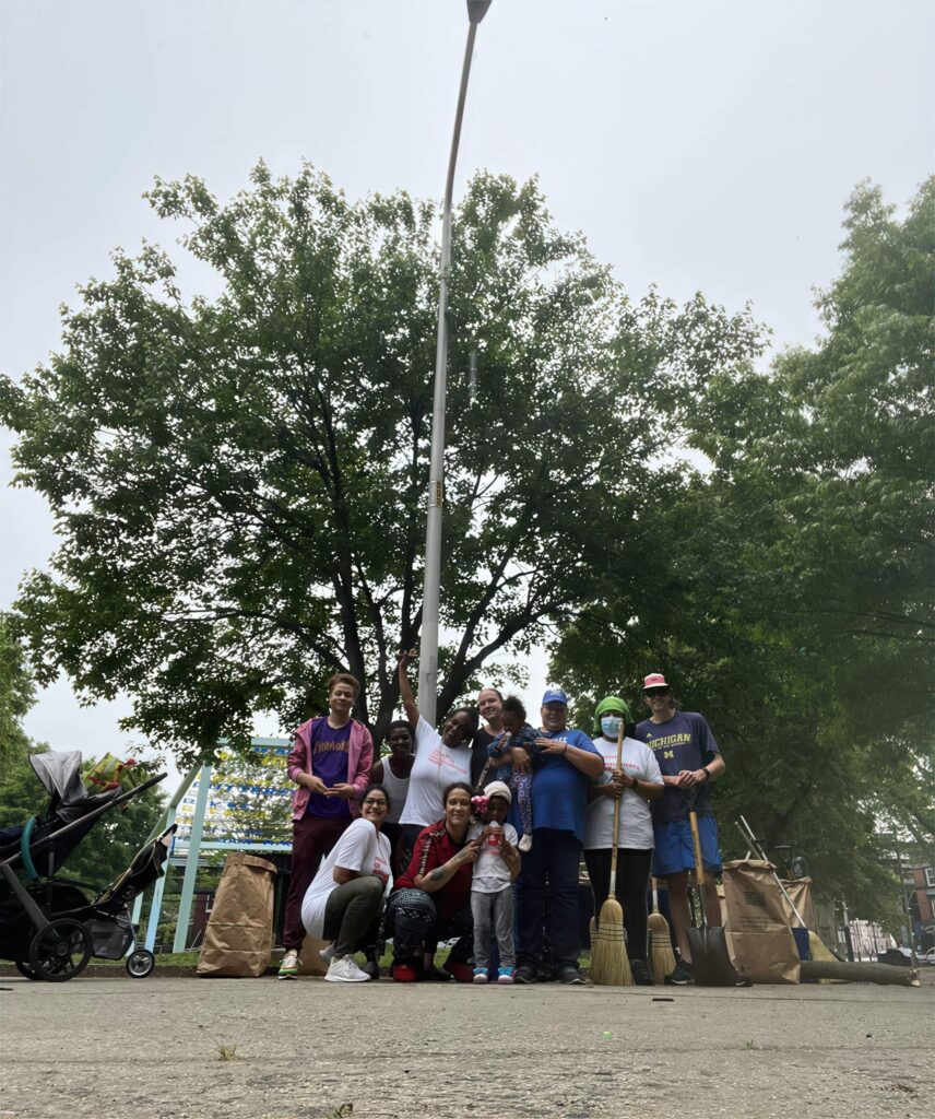 Group Photo taken below a street lamp